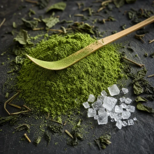 Matcha powder with bamboo scoop on slate