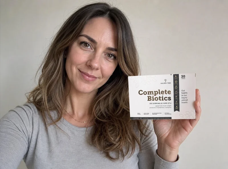 Woman holding Complete Biotics bottle selfie