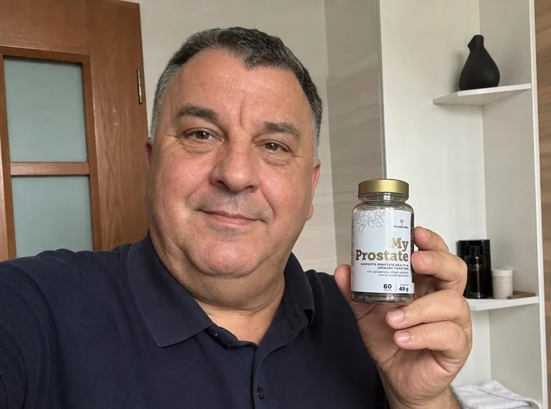 Man aged 63 holding prostate supplement